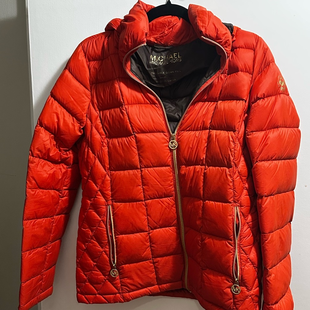 Michael Kors Orange Puffer Jacket with gold zipper accents